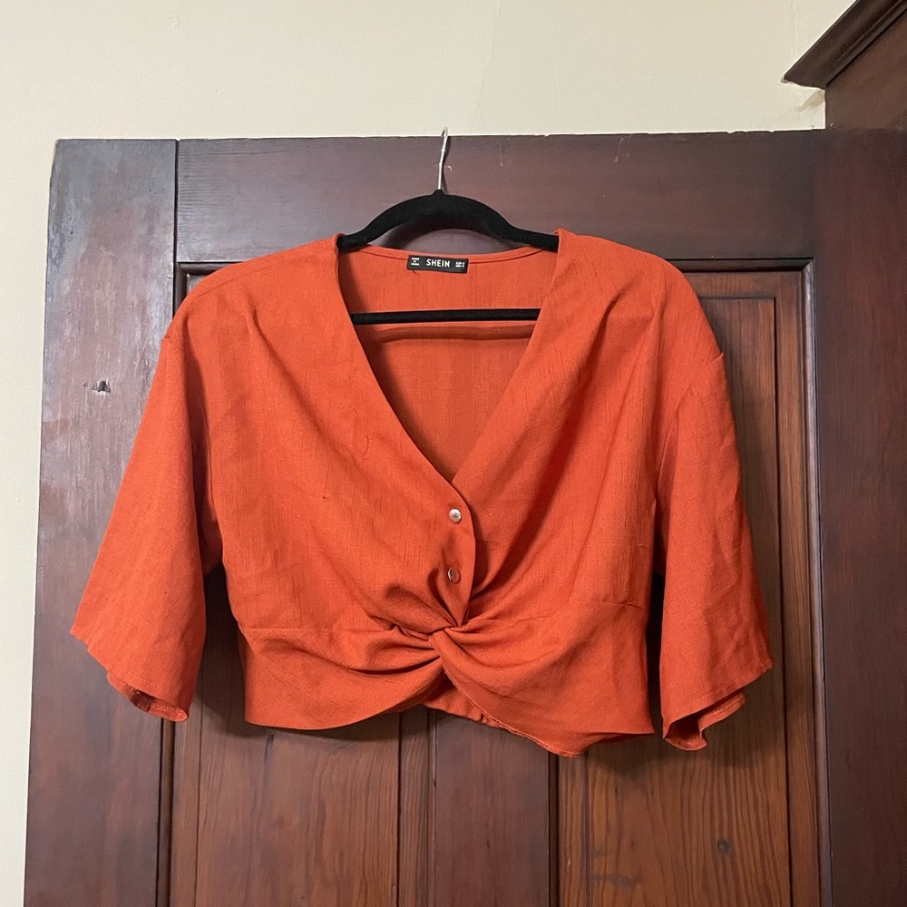 Rusty orange crop top with silver buttons